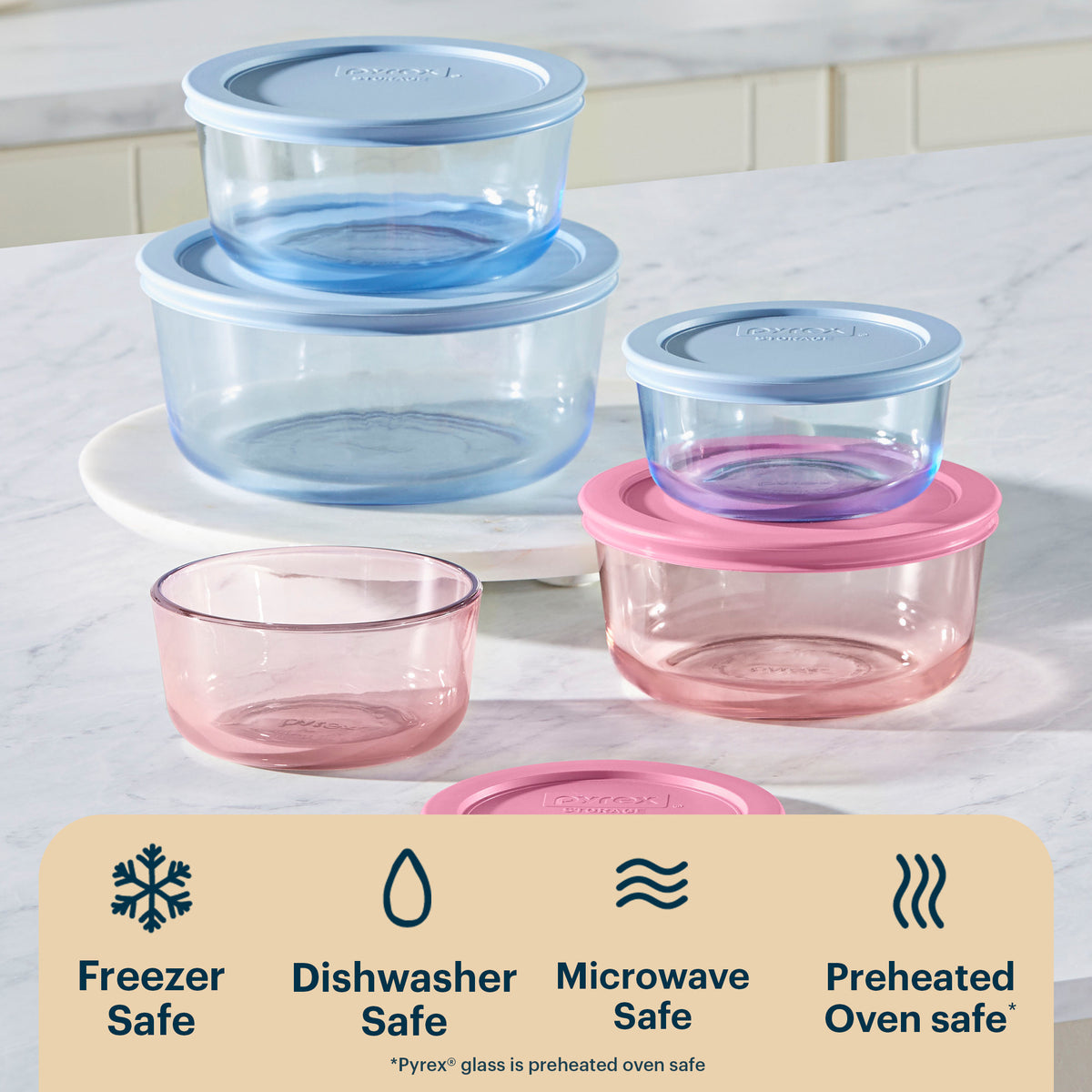 Set of glass food containers with lids on a white surface, featuring Pyrex branding.