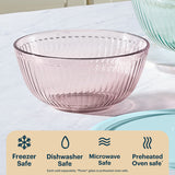 empty sculpted tinted bowl, pink on a marble surface