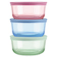 Three colorful food storage containers stacked on a white background