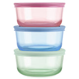 Three colorful food storage containers stacked on a white background