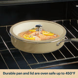 Ceramic cookware with lid containing salmon dish inside an oven.
