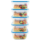 Stack of food storage containers with meals inside on a white background